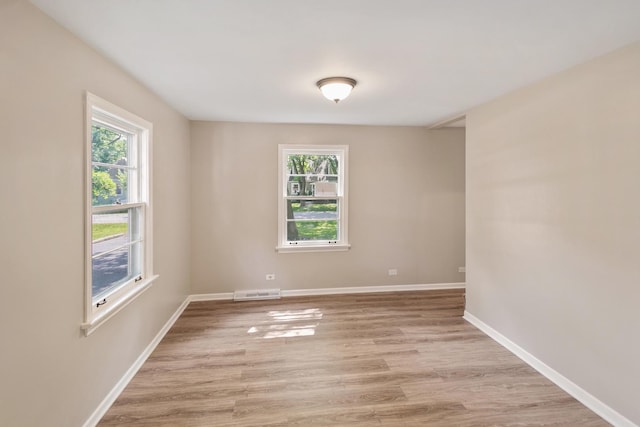 14348 Knox Ave, Midlothian, IL 60445 - spare room with healthy amount of natural light and light wood-type flooring