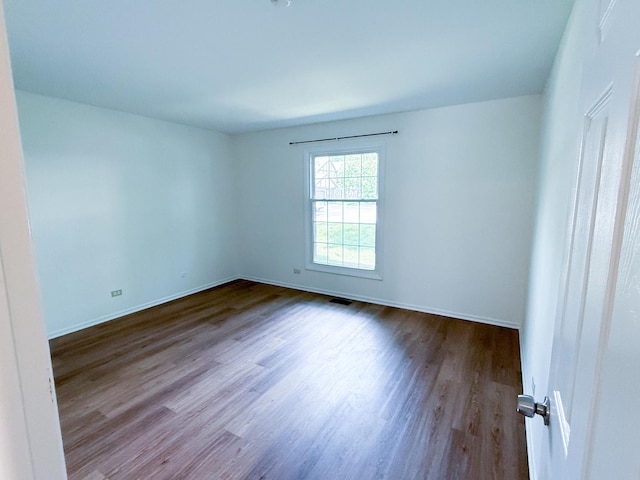 4640 Calvert Dr Unit B1, Rolling Meadows, IL 60008 - spare room featuring wood finished floors and baseboards