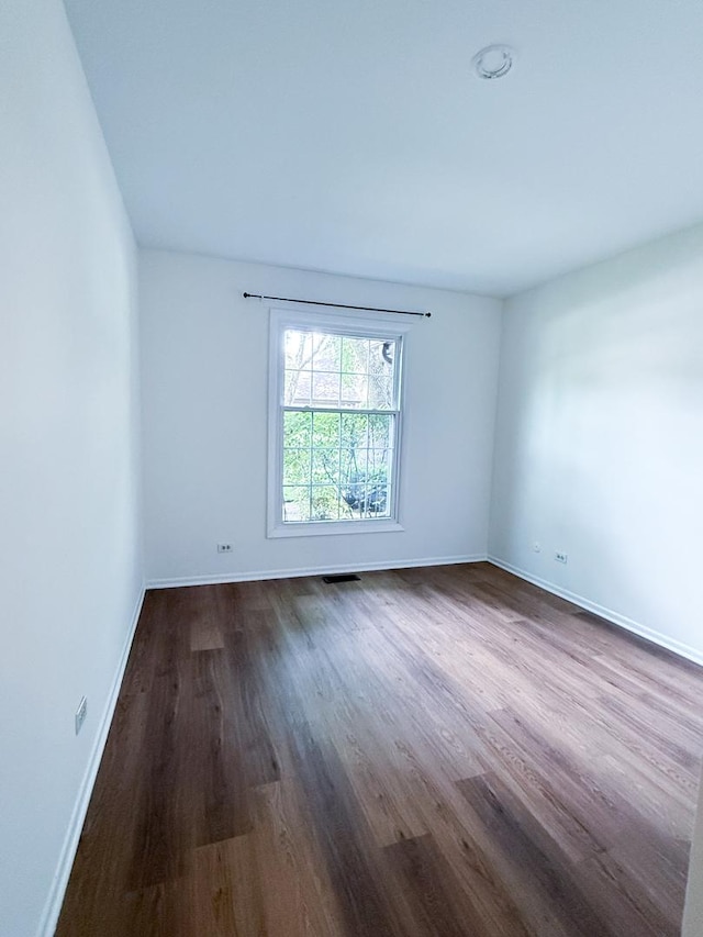 4640 Calvert Dr Unit B1, Rolling Meadows, IL 60008 - unfurnished room featuring dark wood-type flooring and baseboards