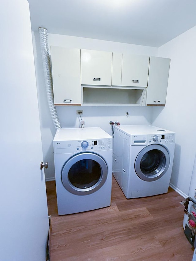 4640 Calvert Dr Unit B1, Rolling Meadows, IL 60008 - laundry room featuring cabinet space, independent washer and dryer, and light wood-type flooring