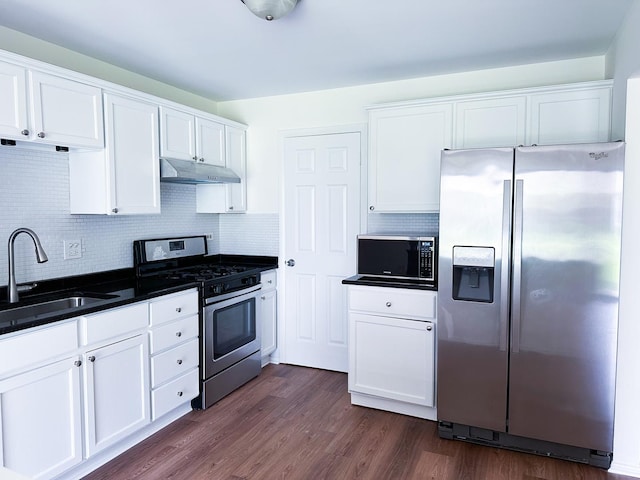 4640 Calvert Dr Unit B1, Rolling Meadows, IL 60008 - kitchen with stainless steel appliances, under cabinet range hood, white cabinets, tasteful backsplash, and dark countertops