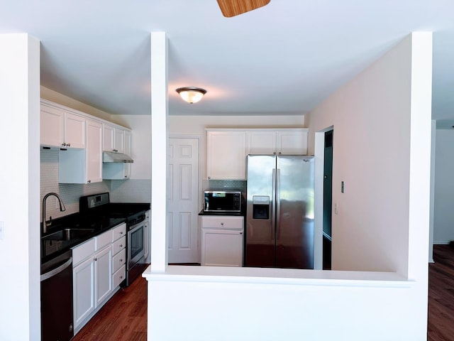4640 Calvert Dr Unit B1, Rolling Meadows, IL 60008 - kitchen featuring stainless steel appliances, under cabinet range hood, decorative backsplash, and white cabinets