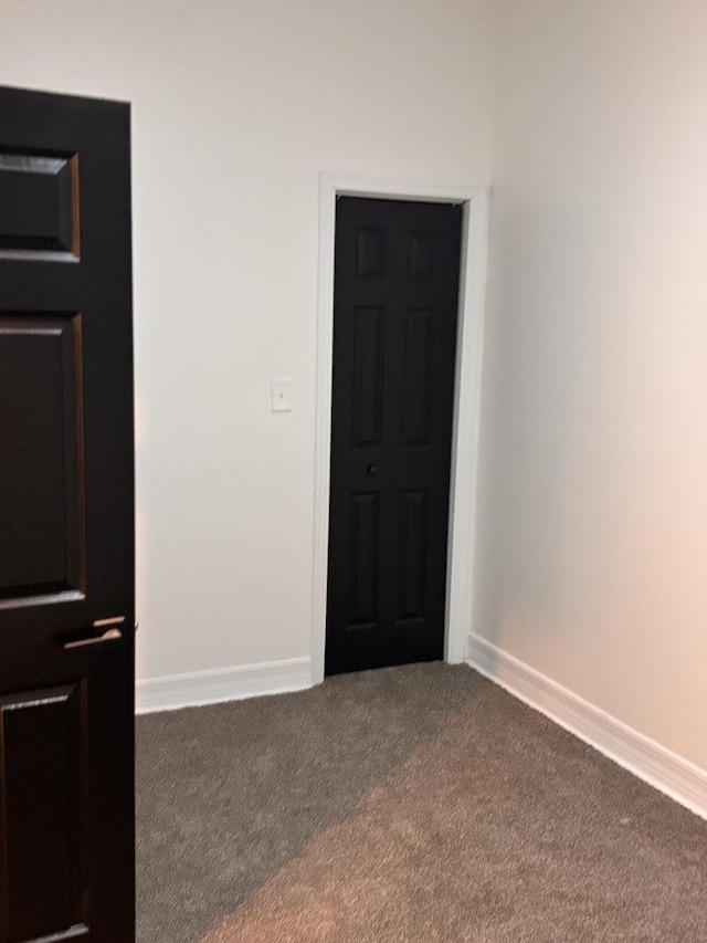 4138 W Adams St, Chicago, IL 60624 - unfurnished room featuring dark colored carpet and baseboards