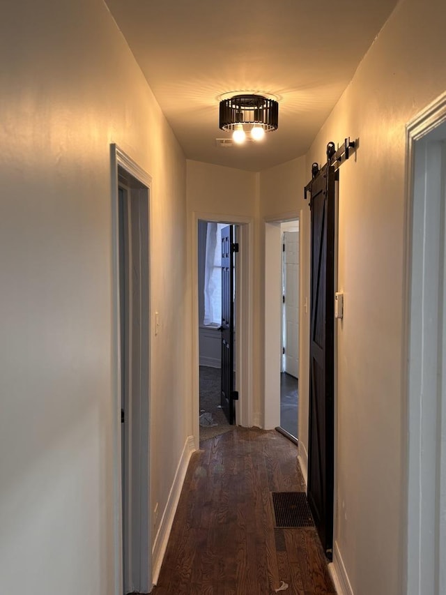 4138 W Adams St, Chicago, IL 60624 - hall with a barn door and dark wood-style floors