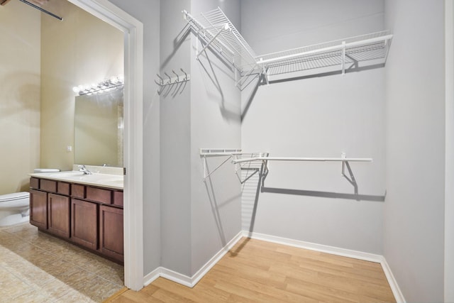 1740 N Maplewood Ave Unit 218, Chicago, IL 60647 - spacious closet featuring light wood-type flooring and a sink