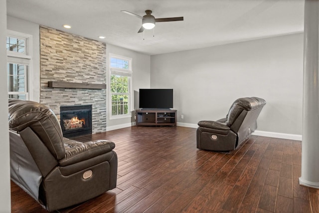 2913 Fox Creek Rd, Bloomington, IL 61705 - living area featuring a stone fireplace, ceiling fan, dark wood-style floors, and recessed lighting