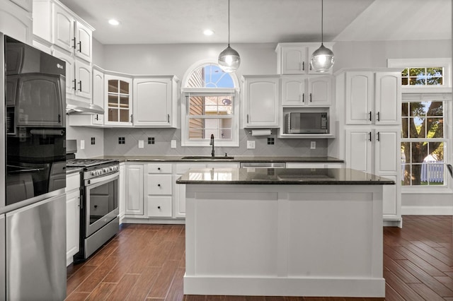 2913 Fox Creek Rd, Bloomington, IL 61705 - kitchen with stainless steel appliances, plenty of natural light, white cabinetry, and recessed lighting