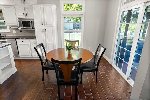 2913 Fox Creek Rd, Bloomington, IL 61705 - dining space with dark wood finished floors