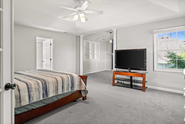 2913 Fox Creek Rd, Bloomington, IL 61705 - bedroom featuring ornate columns, carpet floors, and a ceiling fan