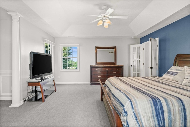 2913 Fox Creek Rd, Bloomington, IL 61705 - carpeted bedroom featuring a raised ceiling, decorative columns, and a ceiling fan