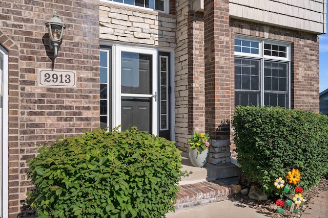 2913 Fox Creek Rd, Bloomington, IL 61705 - view of exterior entry featuring brick siding
