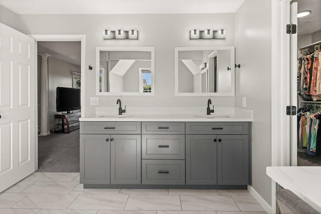 2913 Fox Creek Rd, Bloomington, IL 61705 - full bath with marble look tile flooring, double vanity, and a spacious closet