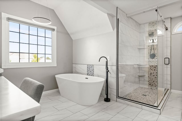 2913 Fox Creek Rd, Bloomington, IL 61705 - bathroom featuring marble look tile flooring, plenty of natural light, a freestanding tub, a shower stall, and lofted ceiling