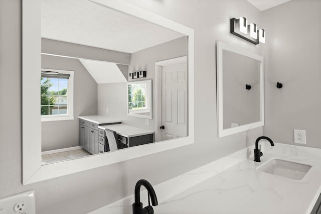 2913 Fox Creek Rd, Bloomington, IL 61705 - bathroom featuring vanity and lofted ceiling