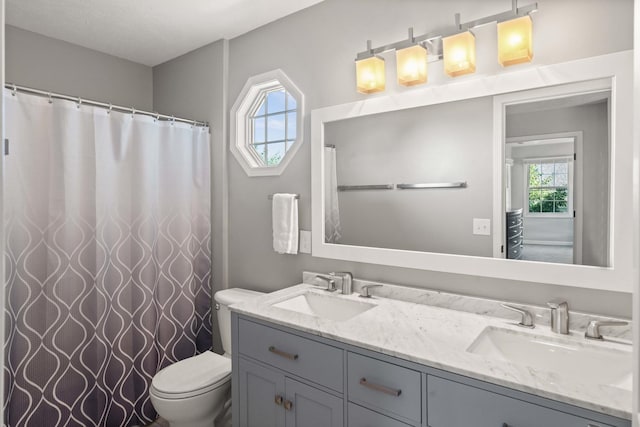 2913 Fox Creek Rd, Bloomington, IL 61705 - bathroom featuring double vanity and curtained shower