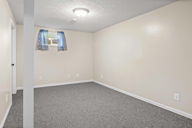 2913 Fox Creek Rd, Bloomington, IL 61705 - spare room with a textured ceiling and dark carpet