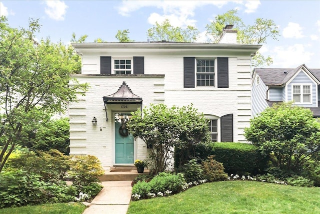 1726 Walnut Ave, Wilmette, IL 60091 - view of front of house featuring a chimney and a front lawn