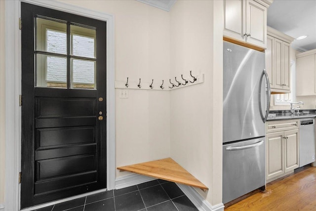 1726 Walnut Ave, Wilmette, IL 60091 - mudroom featuring healthy amount of natural light, tile patterned floors, and ornamental molding