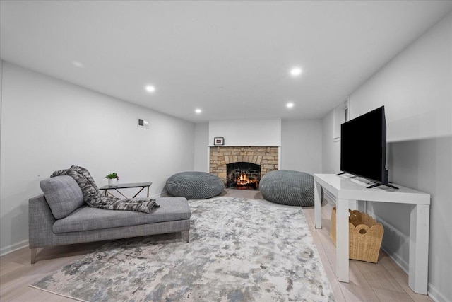 1726 Walnut Ave, Wilmette, IL 60091 - living area with recessed lighting, a warm lit fireplace, and light wood-style flooring