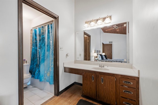 14505 Central Ct Unit Ph4, Oak Forest, IL 60452 - ensuite bathroom featuring vanity, vaulted ceiling, a shower with curtain, and wood finished floors