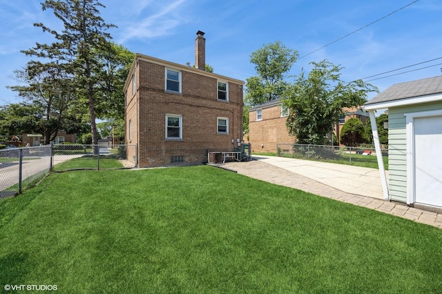 25 N Ashbel Ave, Hillside, IL 60162 - back of property featuring a fenced backyard, a chimney, brick siding, and a patio