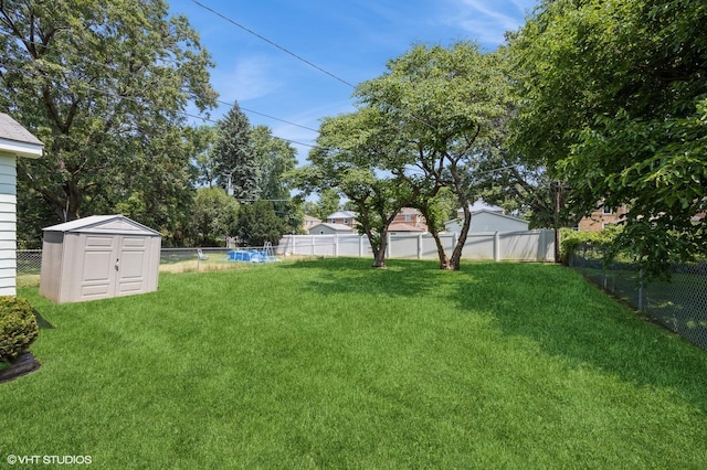 25 N Ashbel Ave, Hillside, IL 60162 - fenced backyard featuring a storage shed