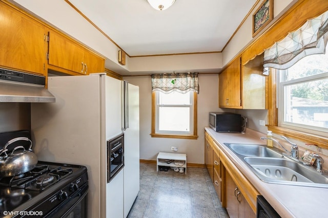 25 N Ashbel Ave, Hillside, IL 60162 - kitchen with stainless steel microwave, range hood, healthy amount of natural light, and gas stove