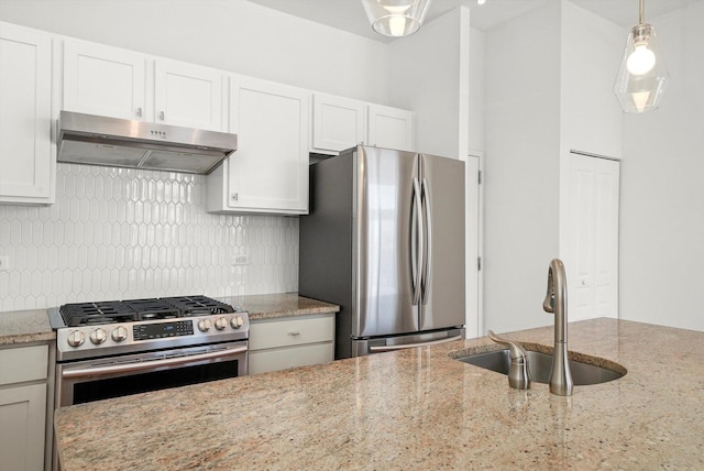 1645 W School St Unit 318, Chicago, IL 60657 - kitchen with stainless steel appliances, under cabinet range hood, backsplash, and light stone countertops