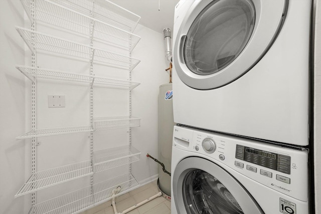 1645 W School St Unit 318, Chicago, IL 60657 - laundry area with stacked washer / drying machine and tile patterned flooring
