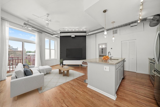 1645 W School St Unit 318, Chicago, IL 60657 - living area with track lighting, wood finished floors, and ceiling fan