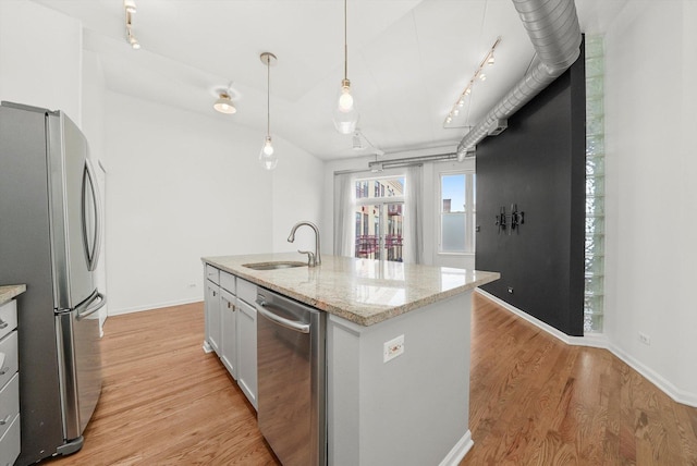1645 W School St Unit 318, Chicago, IL 60657 - kitchen with appliances with stainless steel finishes, rail lighting, light wood finished floors, pendant lighting, and light stone counters