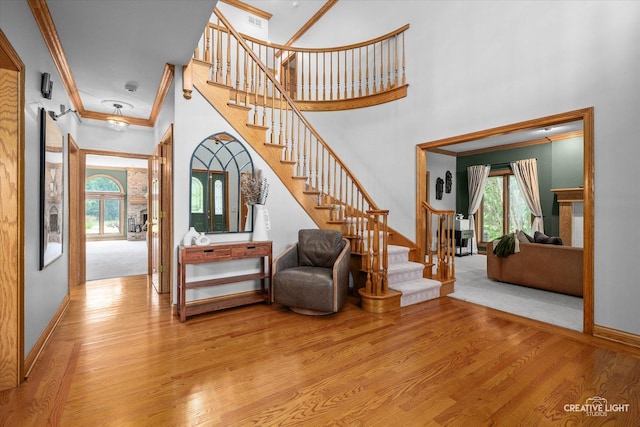 4211 Legend Ct, Naperville, IL 60564 - foyer featuring ornamental molding, wood finished floors, stairway, and a towering ceiling