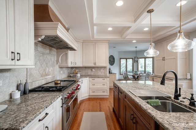 4211 Legend Ct, Naperville, IL 60564 - kitchen with double oven range, light wood-style flooring, coffered ceiling, decorative light fixtures, and beam ceiling