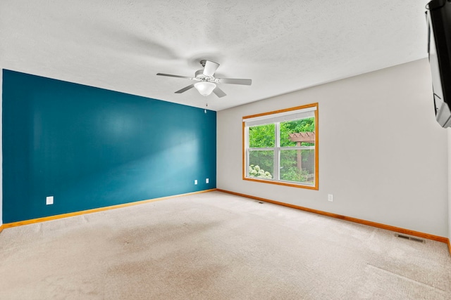 10578 Harrison Ct, Roscoe, IL 61073 - carpeted spare room with ceiling fan and a textured ceiling