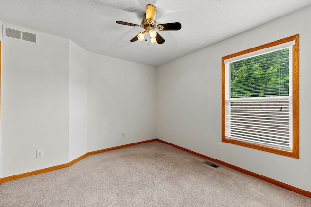 10578 Harrison Ct, Roscoe, IL 61073 - carpeted empty room featuring baseboards and a ceiling fan