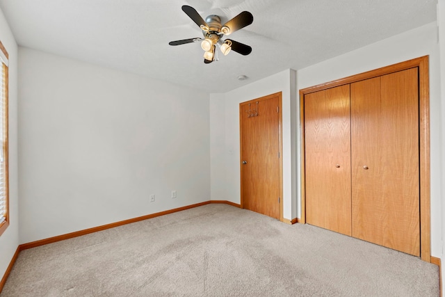 10578 Harrison Ct, Roscoe, IL 61073 - unfurnished bedroom with carpet flooring, a closet, and a ceiling fan