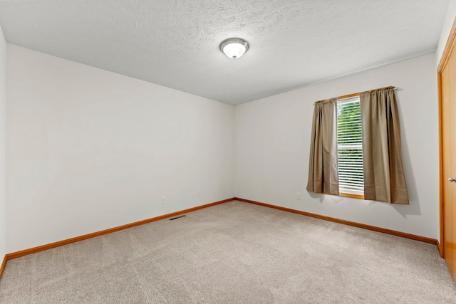 10578 Harrison Ct, Roscoe, IL 61073 - unfurnished room with carpet and a textured ceiling