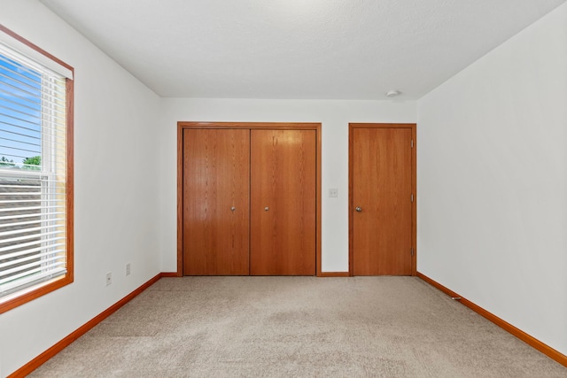 10578 Harrison Ct, Roscoe, IL 61073 - unfurnished bedroom featuring a closet and carpet flooring