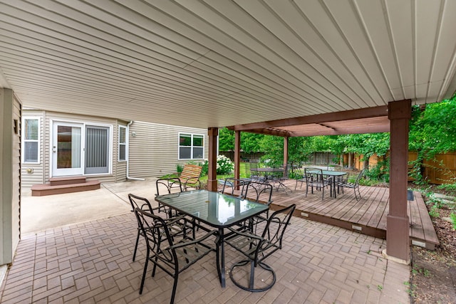 10578 Harrison Ct, Roscoe, IL 61073 - fenced backyard with outdoor dining space, a deck, and a patio area