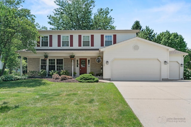 1120 Bennington Dr, Crystal Lake, IL 60014 - view of front facade with an attached garage, concrete driveway, a front lawn, and brick siding
