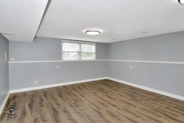 7027 174th Pl, Tinley Park, IL 60477 - unfurnished room with wood finished floors and baseboards