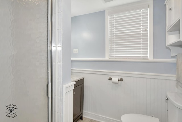 7027 174th Pl, Tinley Park, IL 60477 - full bath with wainscoting, a stall shower, and vanity