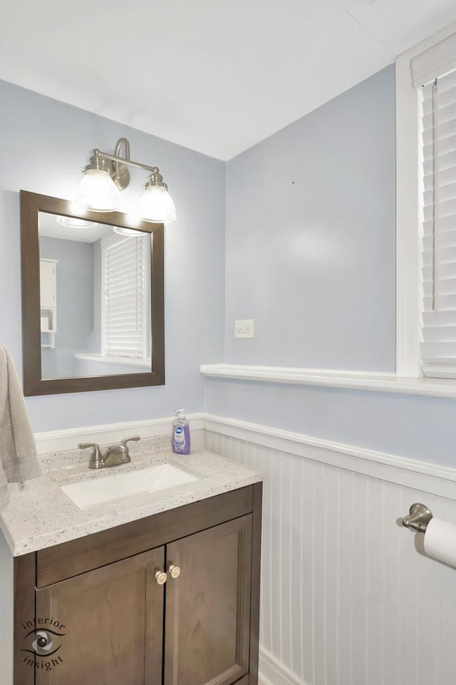 7027 174th Pl, Tinley Park, IL 60477 - bathroom featuring a wainscoted wall and vanity