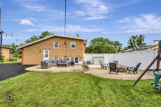 7027 174th Pl, Tinley Park, IL 60477 - rear view of property featuring a patio area, brick siding, and an outdoor living space with a fire pit