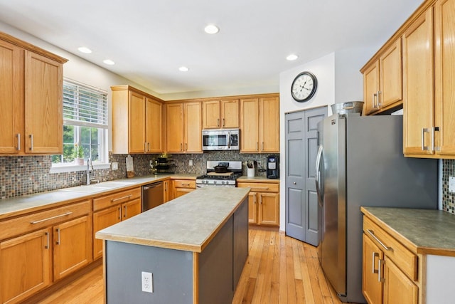 1271 Mcdole Dr, Sugar Grove, IL 60554 - kitchen with stainless steel appliances, light wood finished floors, tasteful backsplash, a kitchen island, and recessed lighting