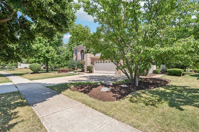 1271 Mcdole Dr, Sugar Grove, IL 60554 - view of property hidden behind natural elements featuring driveway, a front yard, and an attached garage