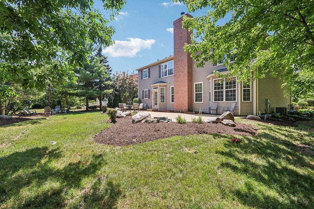 1271 Mcdole Dr, Sugar Grove, IL 60554 - back of house with a patio area, a chimney, and a yard