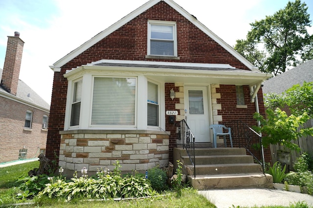 3321 W 71st St, Chicago, IL 60629 - bungalow-style house featuring brick siding and stone siding