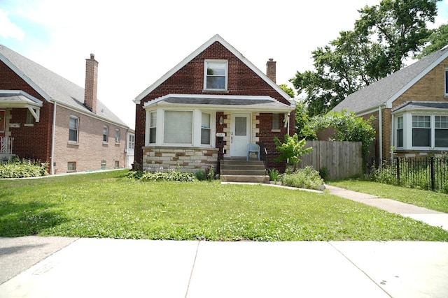 3321 W 71st St, Chicago, IL 60629 - bungalow-style home with a chimney and stone siding