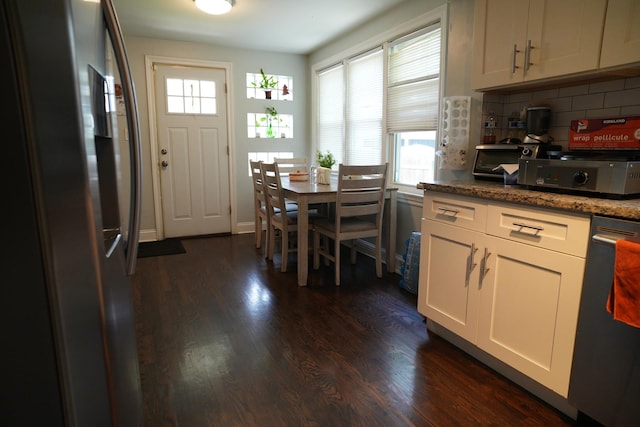 3321 W 71st St, Chicago, IL 60629 - kitchen featuring freestanding refrigerator, decorative backsplash, dark wood-style flooring, and dishwasher